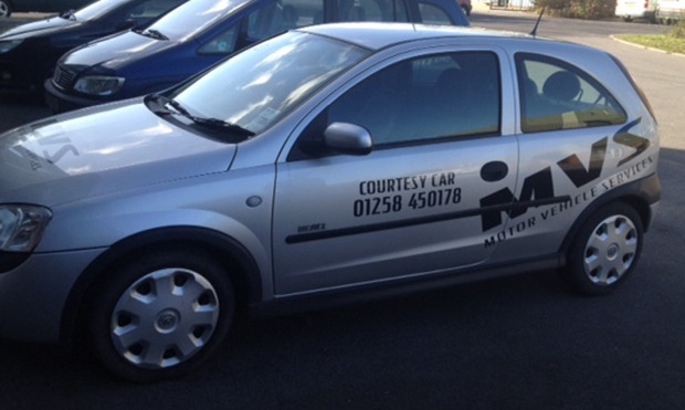Silver MVS courtesy car with Courtesy Car 01258 450178 on the door